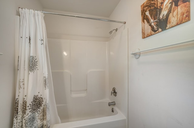 bathroom featuring shower / tub combo with curtain