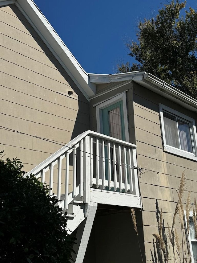 view of home's exterior with a balcony