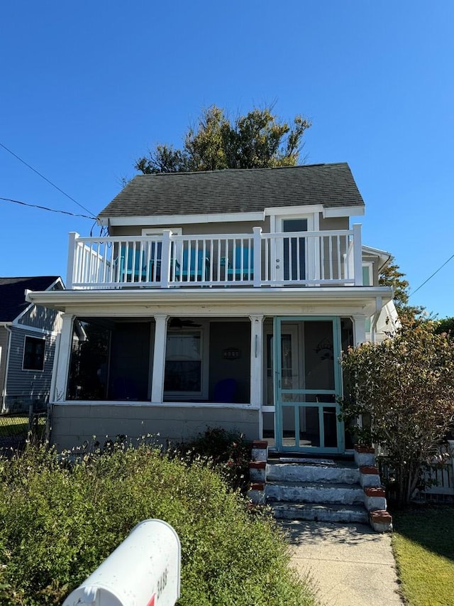 view of front of home featuring a balcony