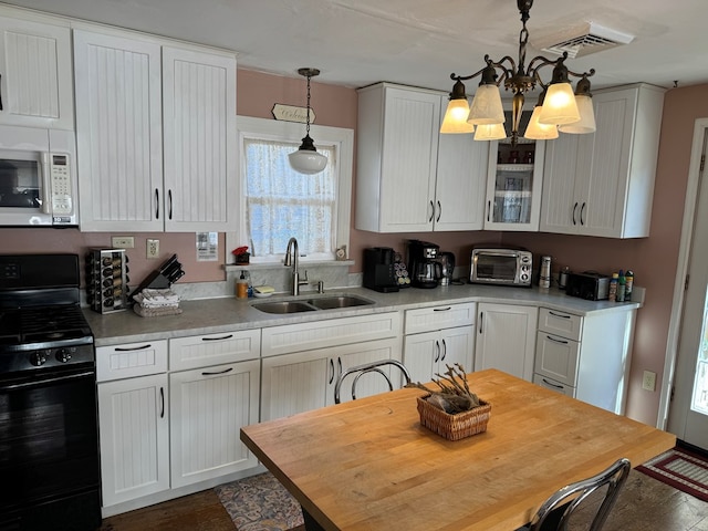 kitchen featuring sink, an inviting chandelier, black / electric stove, pendant lighting, and white cabinets