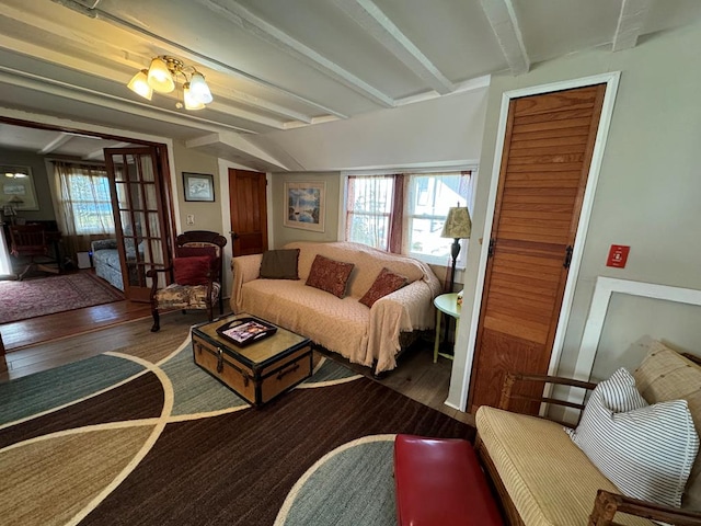 living room featuring beam ceiling and wood-type flooring