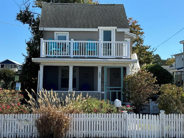 view of front of house featuring a balcony