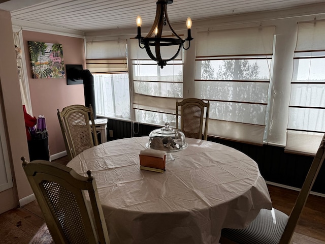 dining room featuring wood-type flooring and a chandelier