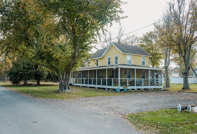 view of front facade featuring a sunroom