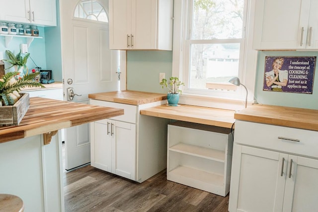 kitchen featuring wood counters, white cabinetry, and dark wood-type flooring