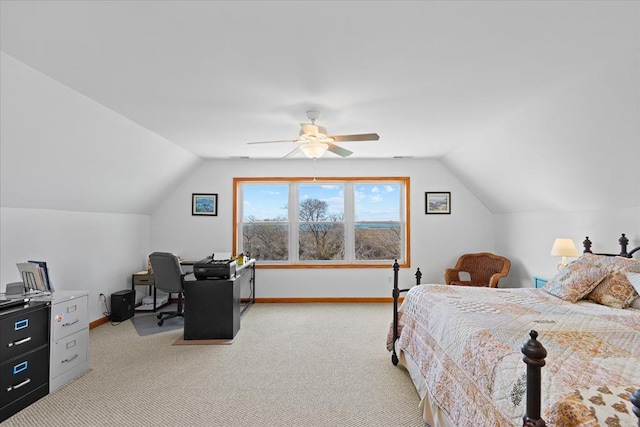 bedroom featuring ceiling fan, lofted ceiling, baseboards, and light carpet