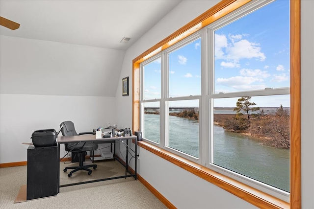 carpeted office with baseboards, a water view, lofted ceiling, and visible vents