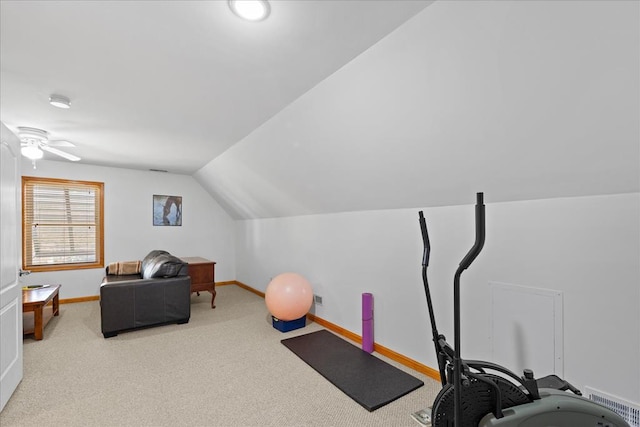 exercise area featuring lofted ceiling, carpet flooring, baseboards, and ceiling fan