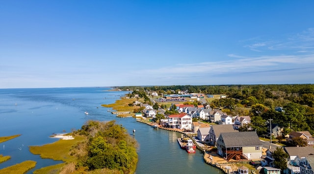 drone / aerial view featuring a water view and a residential view