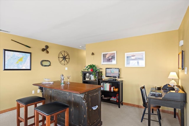 interior space featuring light carpet, visible vents, and baseboards