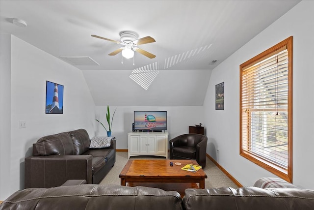 carpeted living room with ceiling fan, baseboards, and lofted ceiling