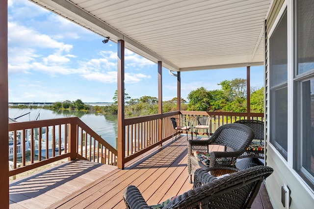 wooden deck with a water view