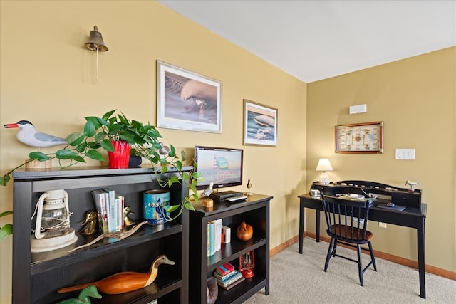 carpeted office featuring baseboards