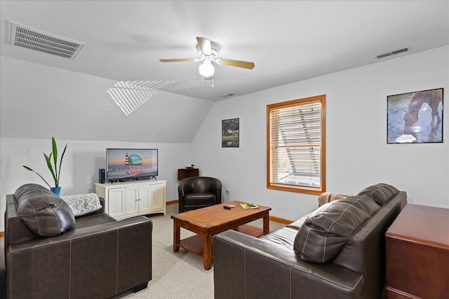 living room featuring visible vents, light colored carpet, a ceiling fan, and vaulted ceiling