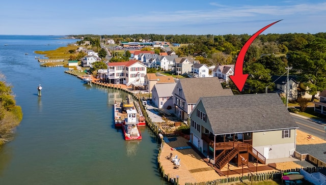 aerial view featuring a water view and a residential view