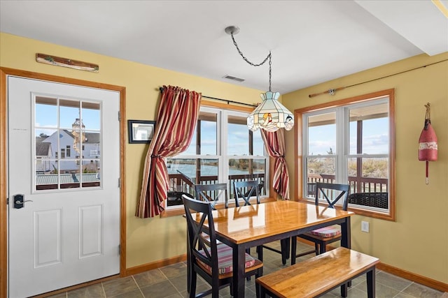 dining area featuring visible vents and baseboards