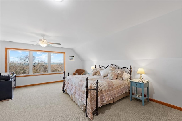 bedroom featuring ceiling fan, carpet, baseboards, and vaulted ceiling