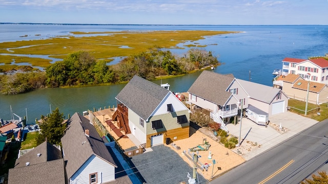 bird's eye view featuring a water view and a residential view