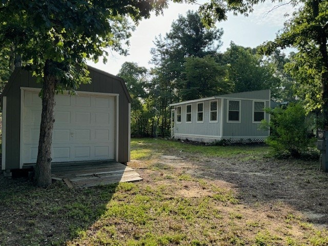 exterior space with an outdoor structure and a garage