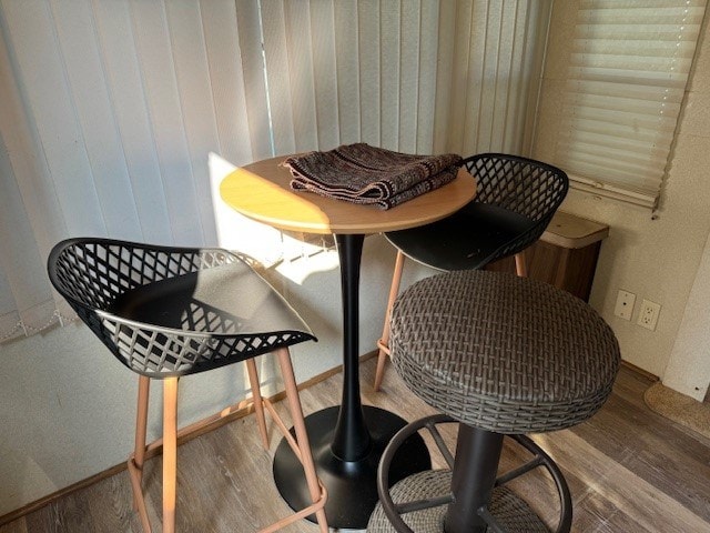 dining area with hardwood / wood-style flooring