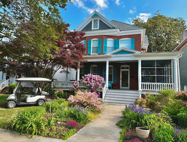 616 Tazewell Ave, Cape Charles, VA 23310 - victorian-style house featuring covered porch and brick siding