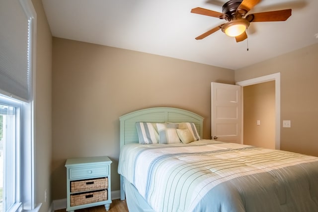 510 Plum St, Cape Charles, VA 23310 - bedroom with baseboards, wood finished floors, and ceiling fan