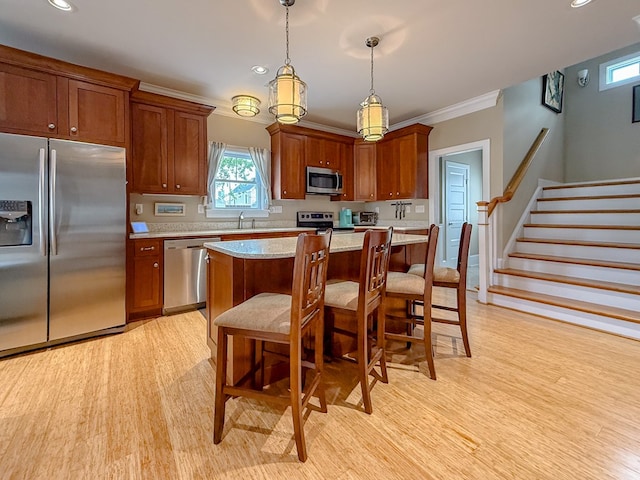 510 Plum St, Cape Charles, VA 23310 - kitchen with a sink, stainless steel appliances, light wood-style floors, light countertops, and ornamental molding