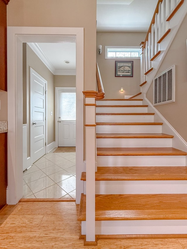 510 Plum St, Cape Charles, VA 23310 - stairs with baseboards, visible vents, crown molding, and plenty of natural light
