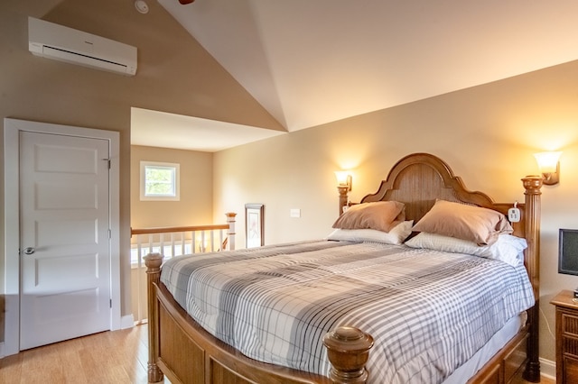 510 Plum St, Cape Charles, VA 23310 - bedroom featuring light wood-type flooring, a wall mounted AC, and vaulted ceiling