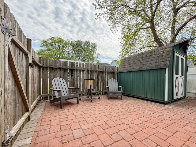 510 Plum St, Cape Charles, VA 23310 - view of patio with a storage shed, a fenced backyard, and an outdoor structure