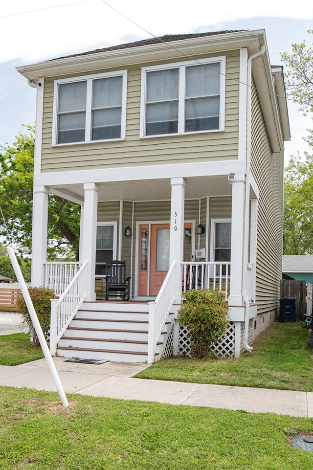 510 Plum St, Cape Charles, VA 23310 - view of front facade featuring a porch and a front lawn