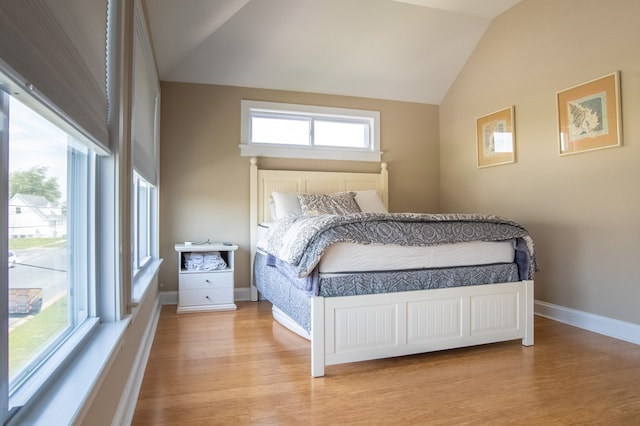 510 Plum St, Cape Charles, VA 23310 - bedroom featuring baseboards, wood finished floors, and vaulted ceiling