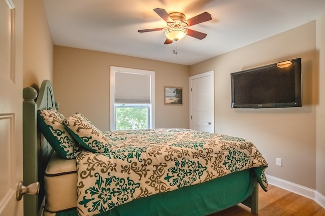 510 Plum St, Cape Charles, VA 23310 - bedroom featuring baseboards, wood finished floors, and ceiling fan