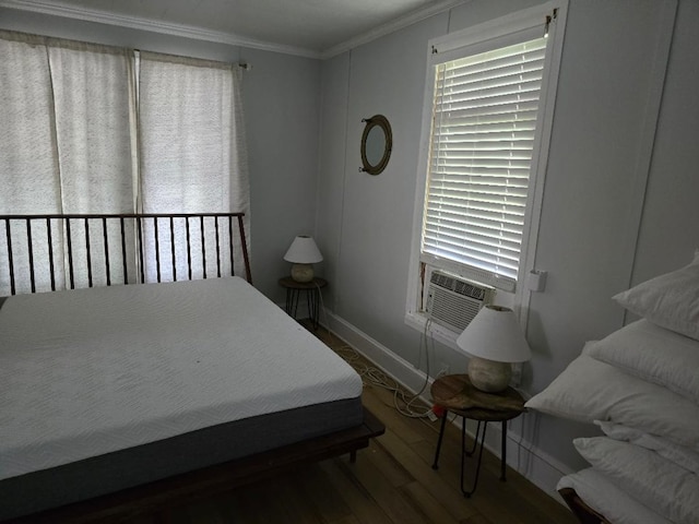 bedroom featuring cooling unit, crown molding, and dark wood-type flooring