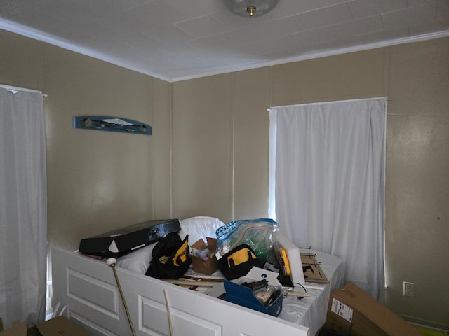 bedroom with ornamental molding