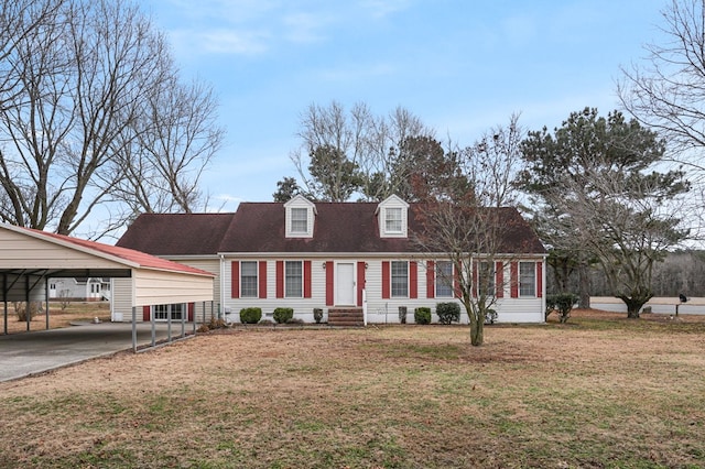 new england style home featuring a carport and a front yard