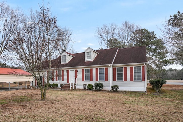 new england style home with a carport and a front lawn