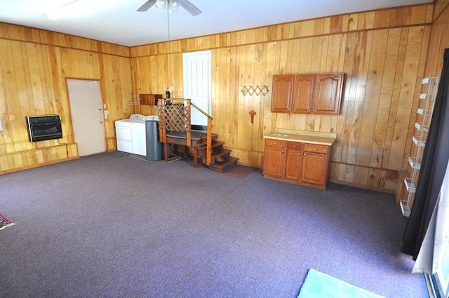 misc room featuring washer and clothes dryer, dark carpet, and heating unit