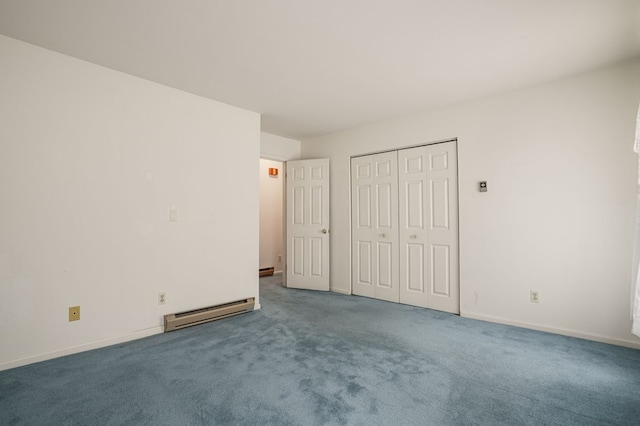 unfurnished bedroom featuring carpet floors, baseboard heating, and a closet