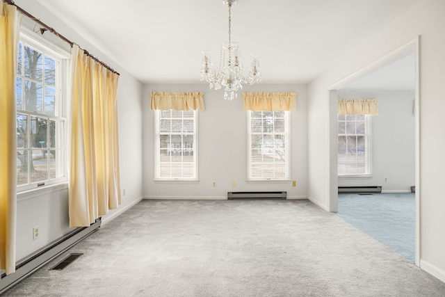 unfurnished dining area featuring an inviting chandelier, carpet flooring, and a baseboard heating unit