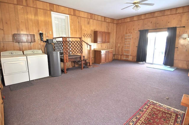 interior space featuring ceiling fan, independent washer and dryer, and dark carpet