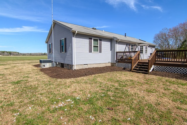 6545 Occohannock Neck Rd, Exmore, VA 23350 - rear view of property with cooling unit, a lawn, and a deck