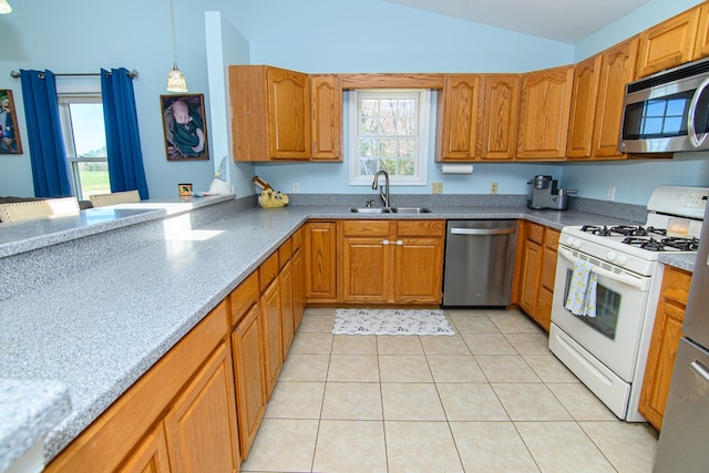 6545 Occohannock Neck Rd, Exmore, VA 23350 - kitchen featuring brown cabinets, stainless steel appliances, lofted ceiling, and a sink