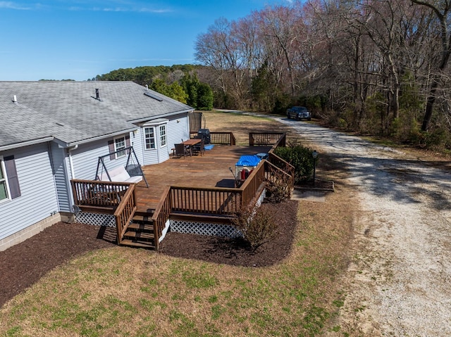 6545 Occohannock Neck Rd, Exmore, VA 23350 - back of house featuring a deck, a forest view, driveway, and a shingled roof