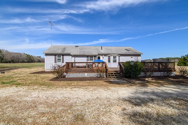 6545 Occohannock Neck Rd, Exmore, VA 23350 - back of property with roof with shingles and a wooden deck