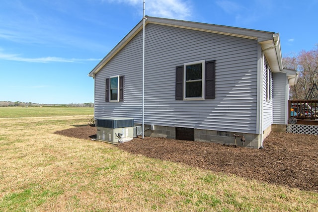 6545 Occohannock Neck Rd, Exmore, VA 23350 - view of side of property featuring a lawn and central AC unit