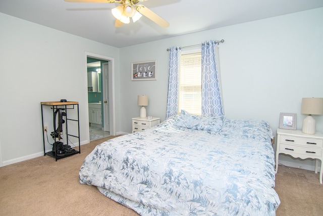 6545 Occohannock Neck Rd, Exmore, VA 23350 - carpeted bedroom with baseboards, ensuite bath, and a ceiling fan