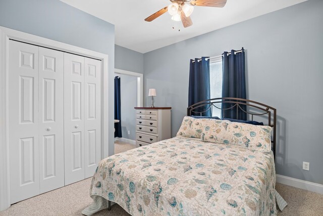 bedroom featuring carpet floors, a closet, and ceiling fan