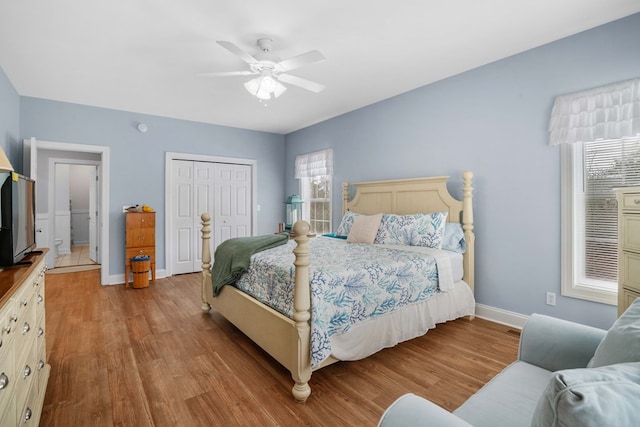 bedroom featuring a closet, ceiling fan, and light hardwood / wood-style flooring