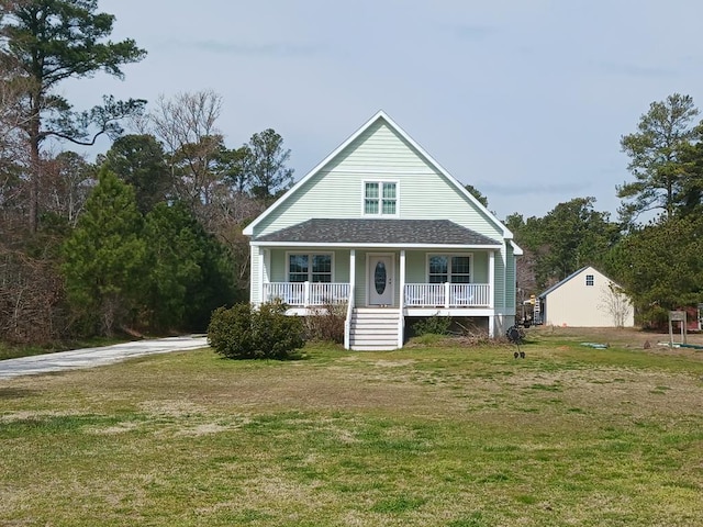 view of front of property with a porch and a front yard